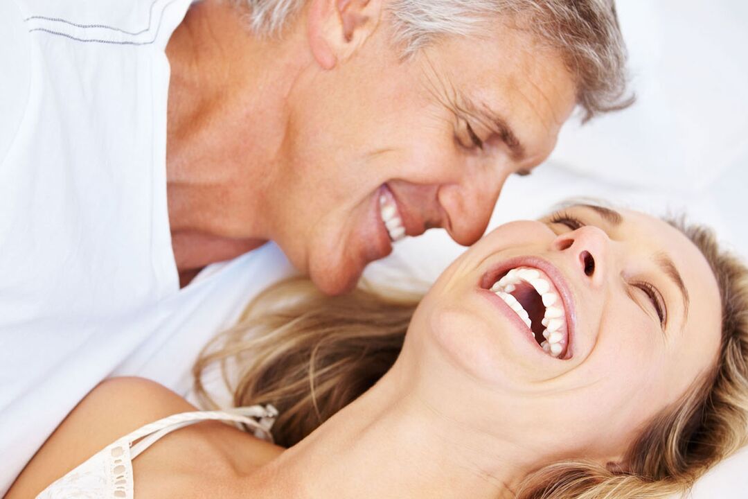 Happy woman with a middle-aged man without potency problems. 